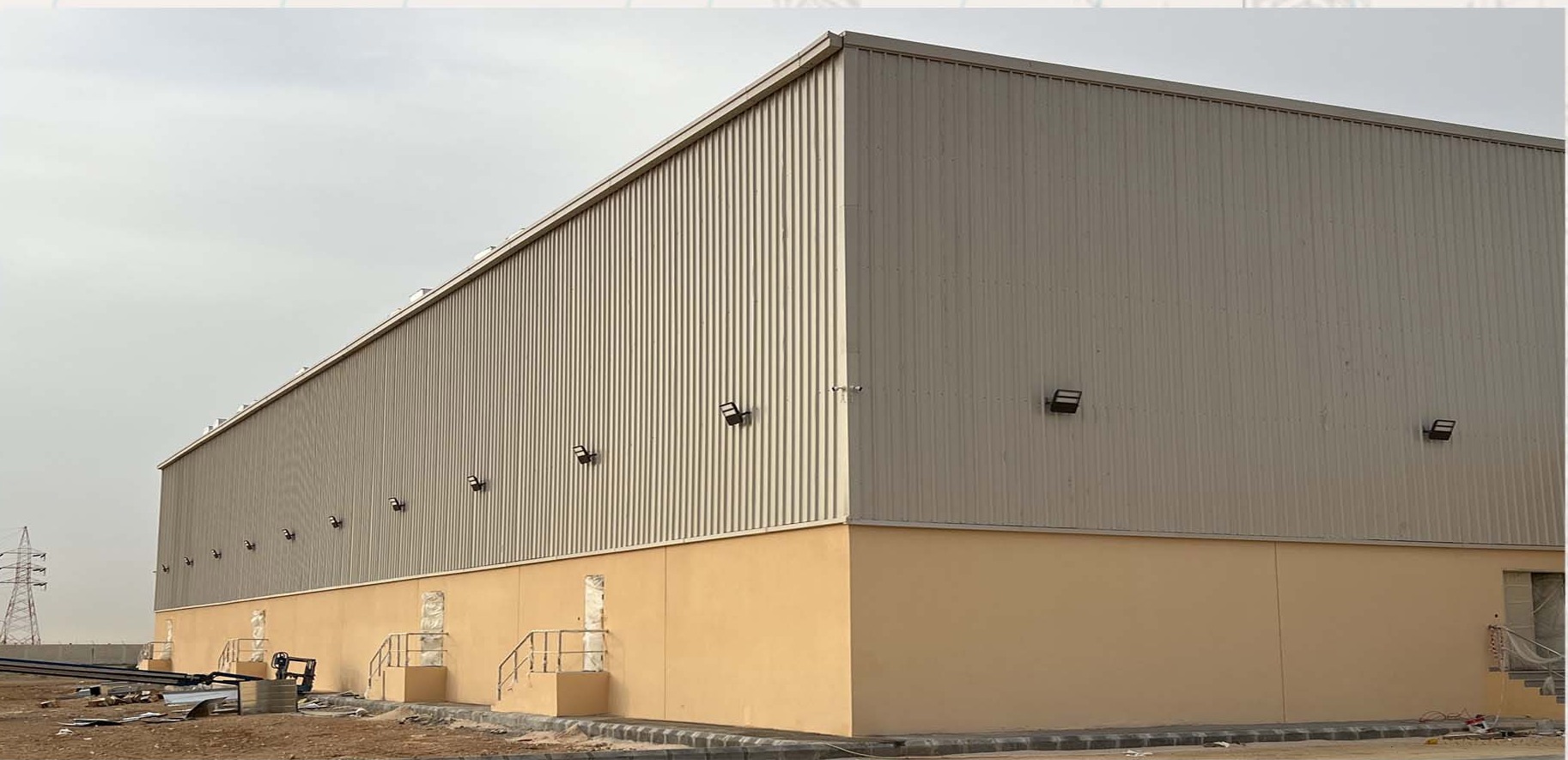Structures & Steel: Steel Structures & Engineering; steel warehouse exterior tan